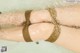 A woman's legs tied up in the water.